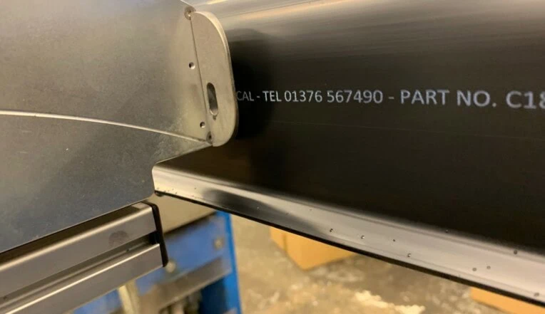 Thermal inkjet printing white ink onto black extrusion