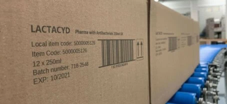 Outer case on conveyor Barcode printed on pharma outer case using seiko large area printer