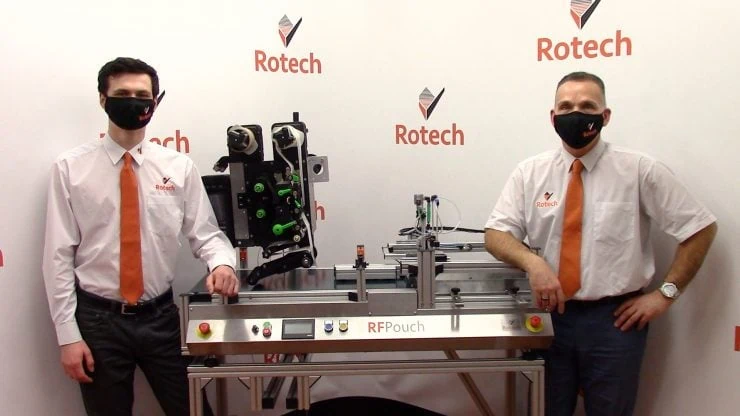 James and Steve, sales team, standing by an RF pouch