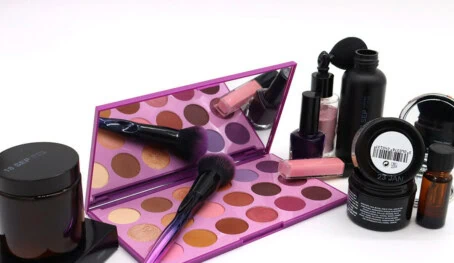 Group cosmetic packaging with white thermal inkjet print applied- glass jar and bottle, plastic tub and bottle, carton