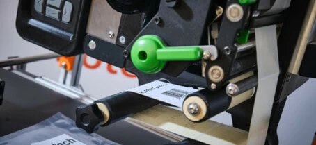 RL Print and Apply labeller printing label on clear pouch with barcode