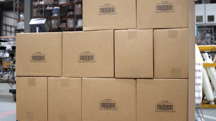 Outercase boxes stacked on pallet in warehouse