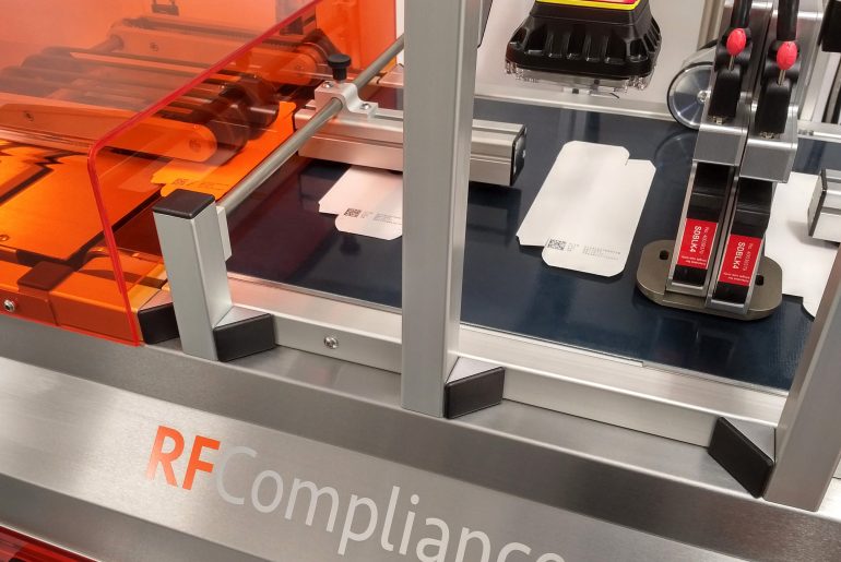 RF Compliance with camera system and medical cartons running along the conveyor
