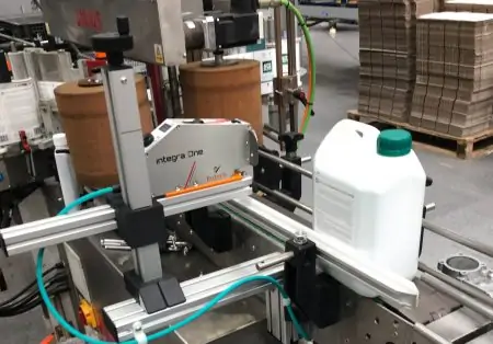 Integra one on automotive production line printing onto large plastic bottles