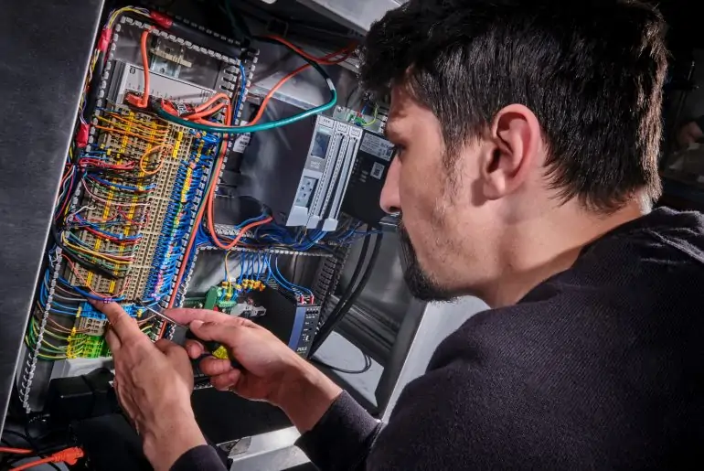 Rotech engineer working on the wiring in a RF Compliance