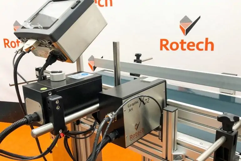 Rotech handling systems. A conveyor to print variable data onto boxes.
