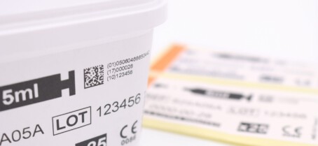Coded and Labelled plastic tub Medical tub packaging with label printed with GS1, batch and serialisation