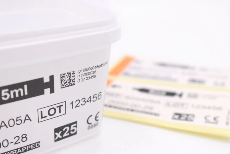 Medical tub packaging with label printed with GS1, batch and serialisation