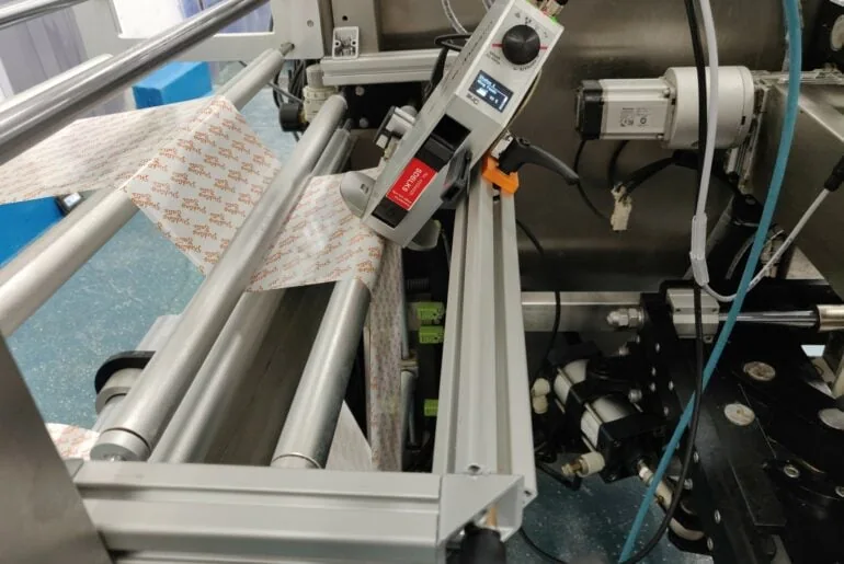 Thermal inkjet printer integrated into flow wrapping machinery