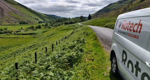  Rotech company van parked by scenic fields