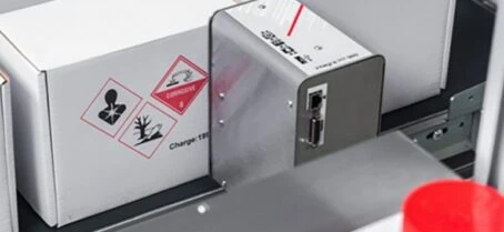 PP108 Bi-colour printing red and black warning label onto outer case